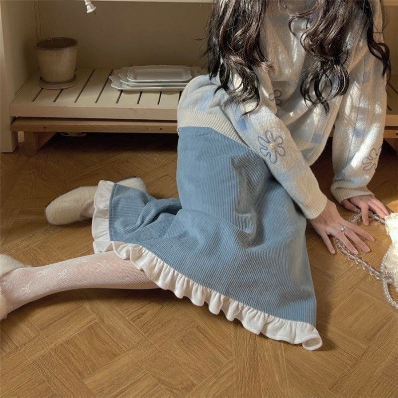 A Woman Wearing A Sweater With A Base Top